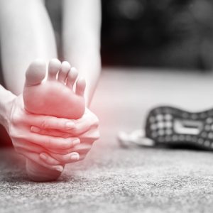 Runner touching painful twisted or broken ankle. Athlete training accident. Sport running sprained sprain cause injury knee. and pain with leg bones.