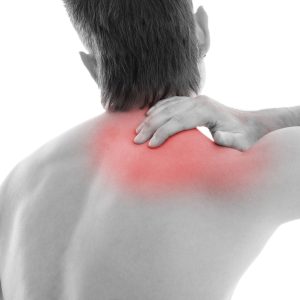 Man is touching his back because it aches